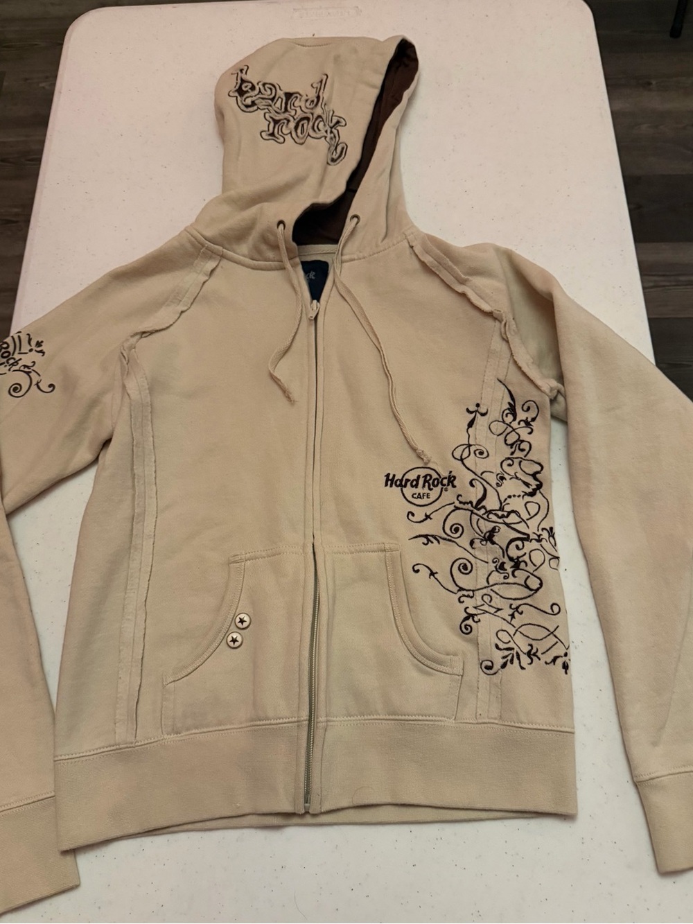 Hard Rock Cafe Beige Hoodie with Dark Brown Swirl Embroidery
